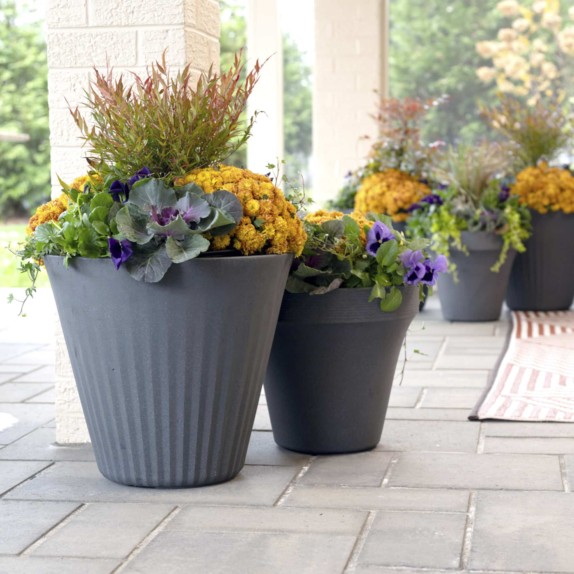 Fold and Ridge Planters with flowers inside